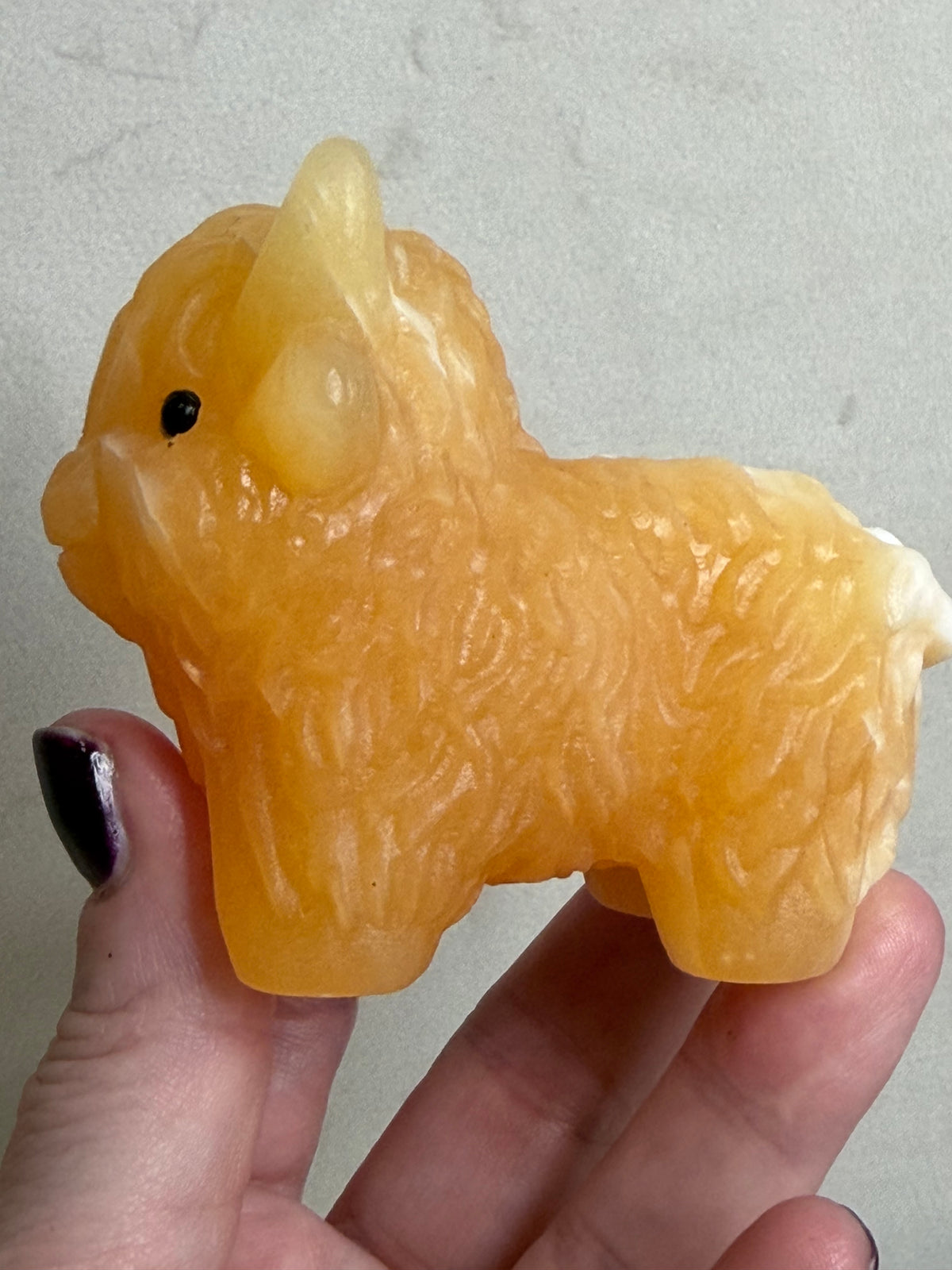 Highland Cow Orange Calcite Carving – 8 cm