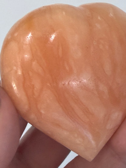 Orange Calcite Heart with Stand – 112g D 6.1cm