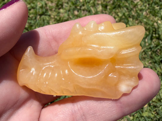 Orange Calcite Dragon Head Carving – 6 × 4 cm