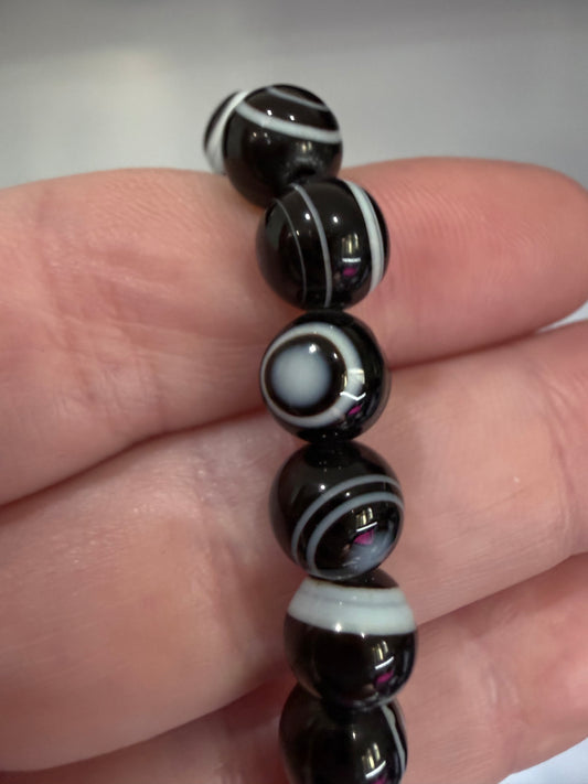 8mm Thousand Eye Dzi Agate Bracelet

Protection • Awareness • Grounding