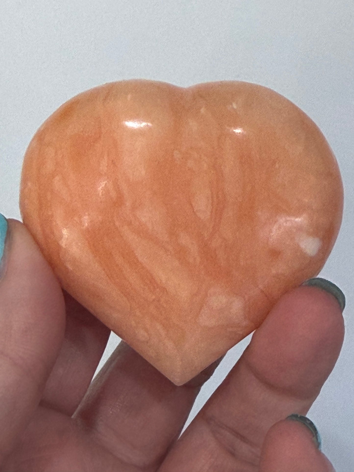 Orange Calcite Heart with Stand – 112g D 6.1cm