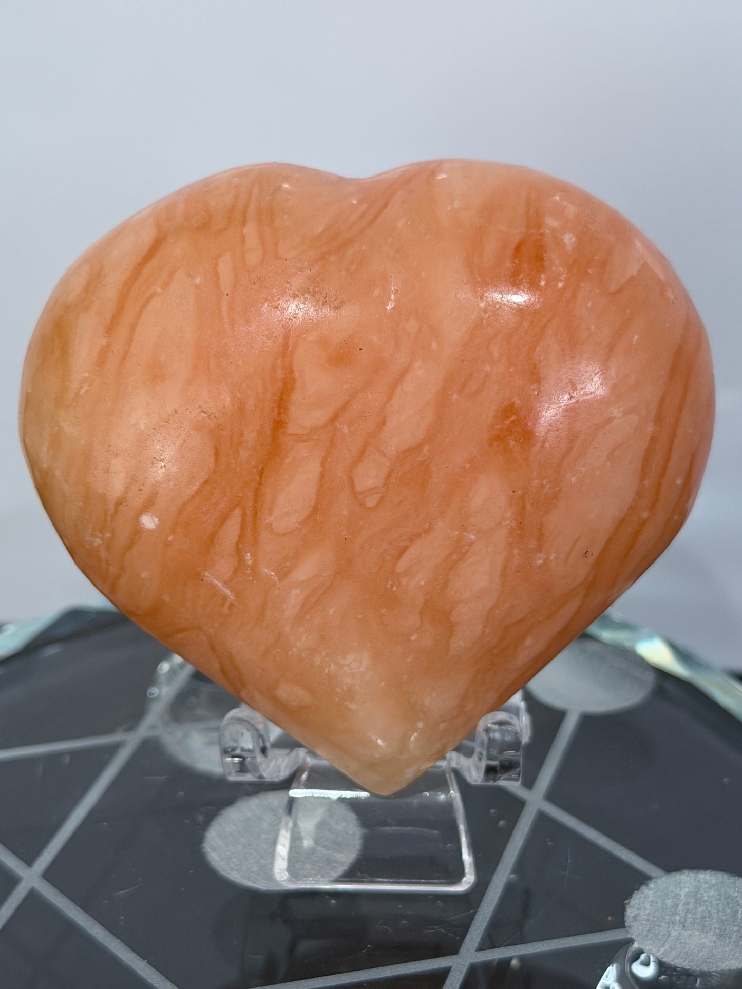 Orange Calcite Heart with Stand – 139g A 6.7cm
