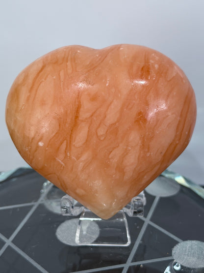 Orange Calcite Heart with Stand – 139g A 6.7cm